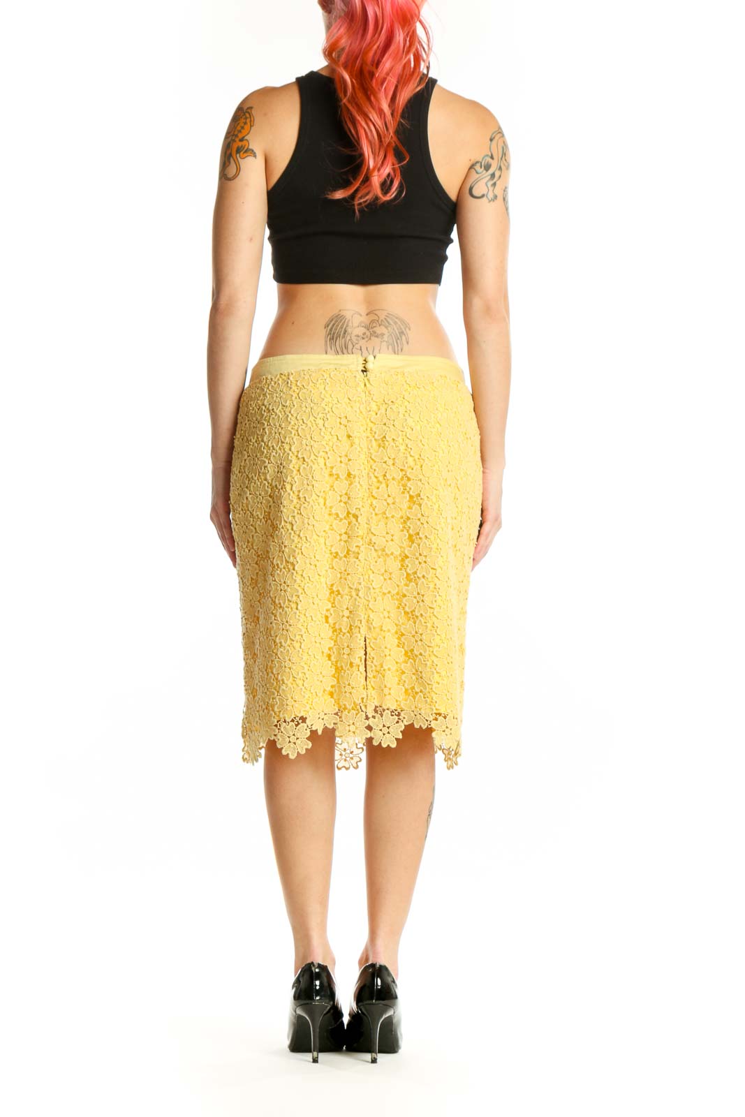 Yellow lace pencil skirt with scalloped edges, back view showing elegant silhouette