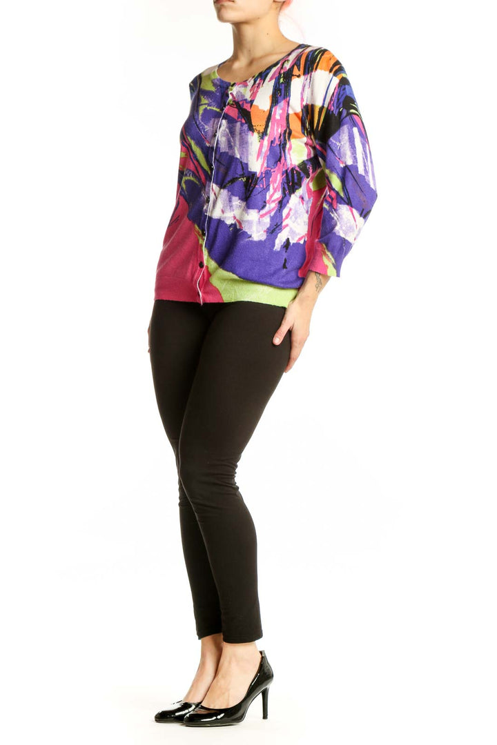 Front view of multicolor abstract cardigan top by JOSEPH A. featuring bold purple, pink, lime green, orange and white artistic print with button-front closure