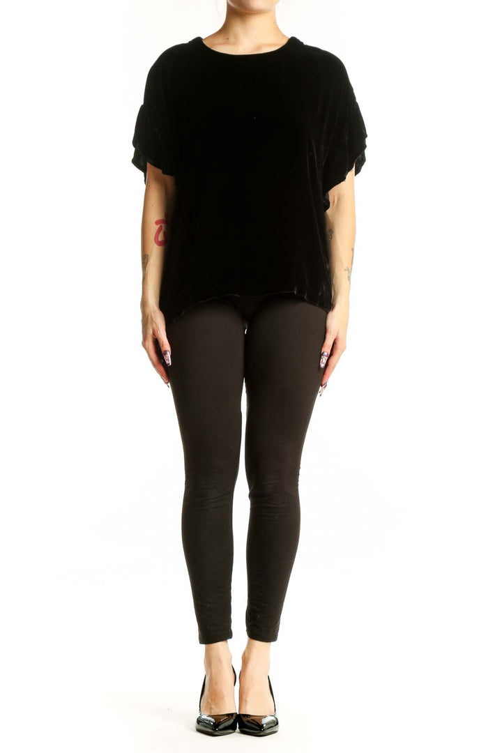 Black velvet short sleeve top with crew neckline and ruched sleeves, front view