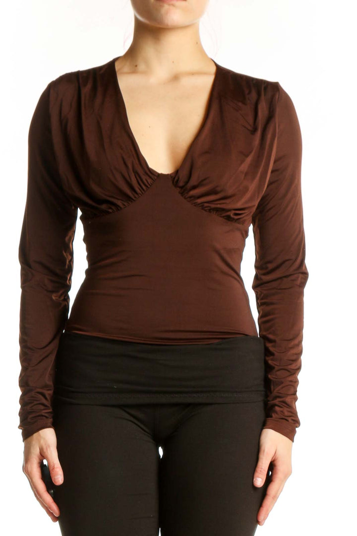 Brown v-neck long sleeve fitted top with ruched bust detailing, front view
