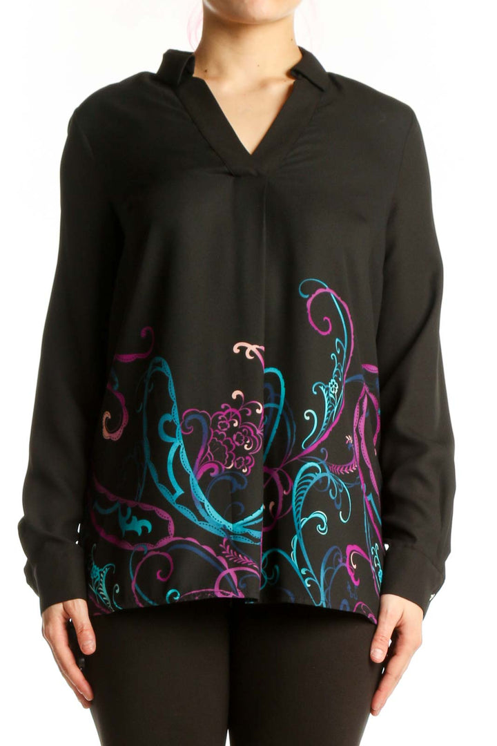 Black Dana Buchman blouse with vibrant teal, magenta, and purple embroidered floral design on front