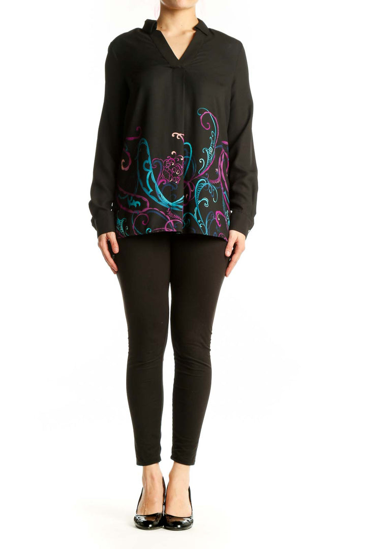 Black Dana Buchman blouse with vibrant teal, magenta, and purple embroidered floral design on front