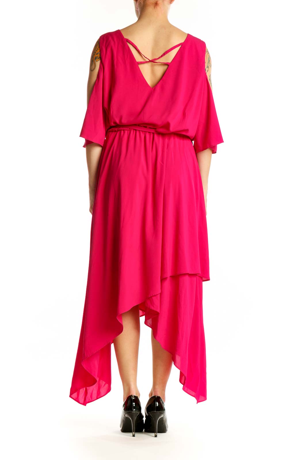 Back view of pink cold shoulder midi dress showing draped sleeves and flowing asymmetrical hem by Lane Bryant