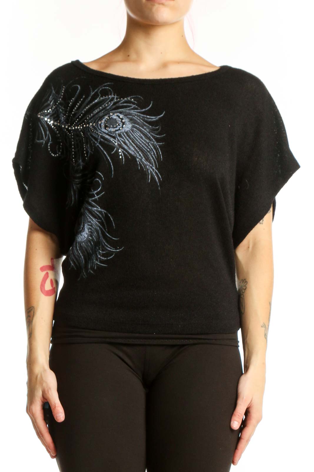 Black embellished top with peacock feather design and shimmering beadwork on front