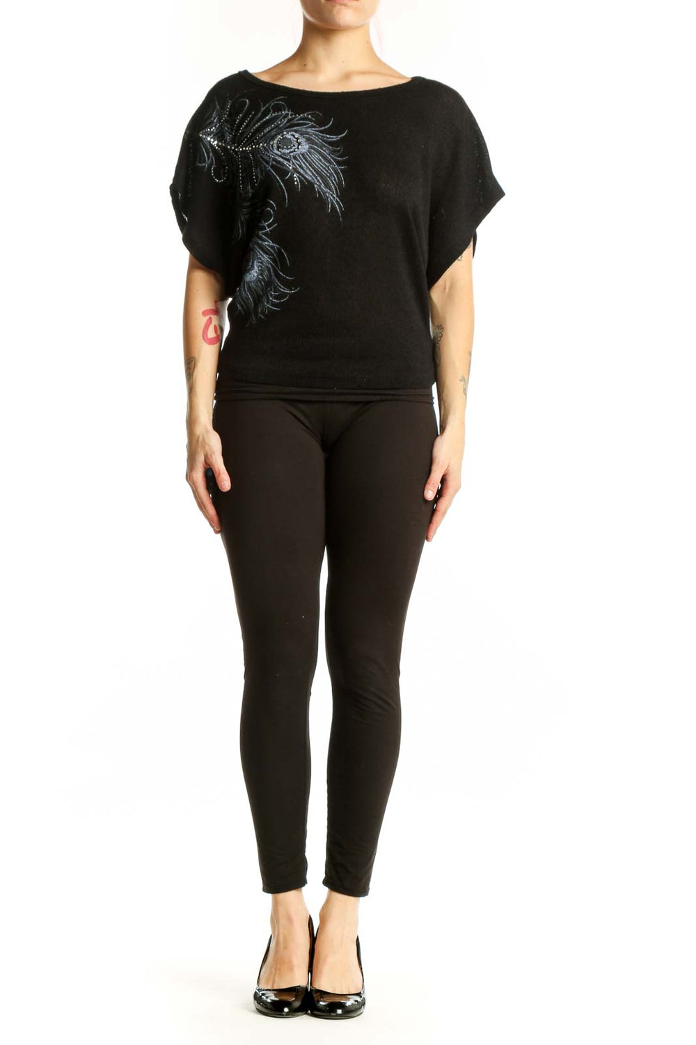 Black embellished top with peacock feather design and shimmering beadwork on front