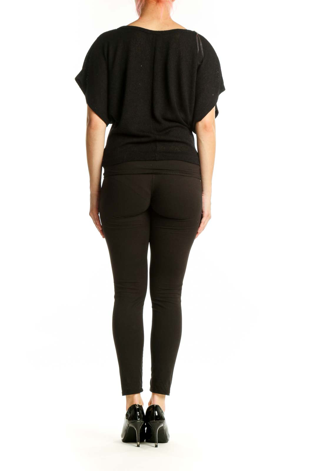 Back view of black embellished top showing peacock feather embroidery detail