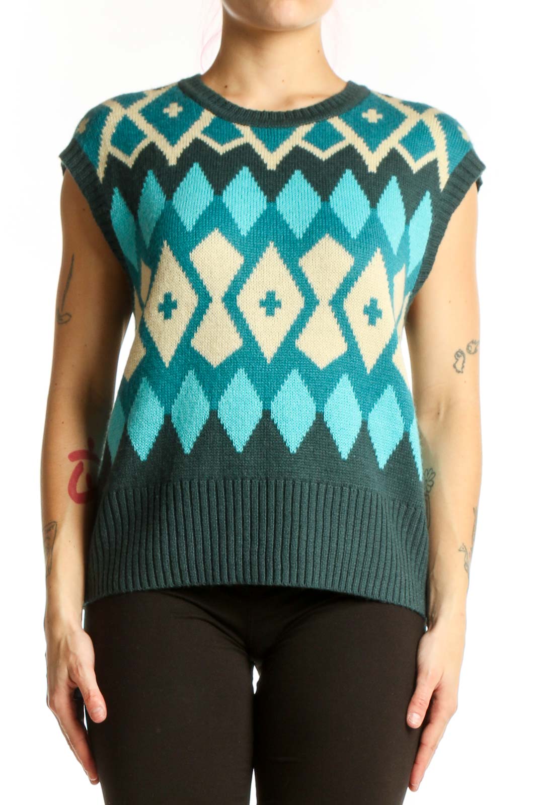 Tyler Boe teal geometric diamond knit vest with cream and charcoal colorblock pattern, front view on model