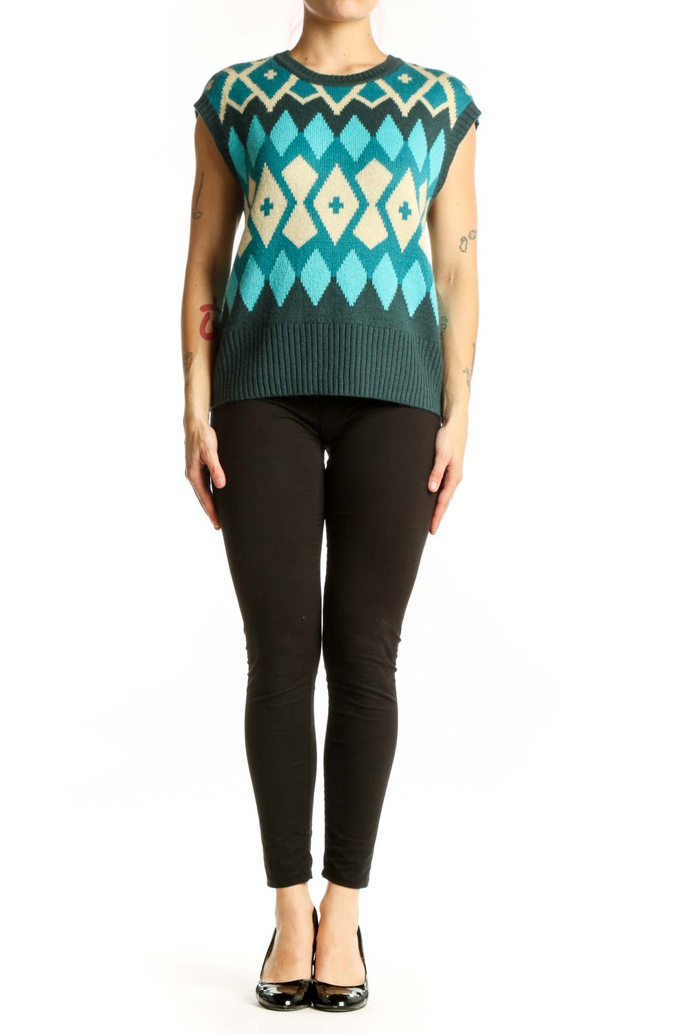 Tyler Boe teal geometric diamond knit vest with cream and charcoal colorblock pattern, front view on model