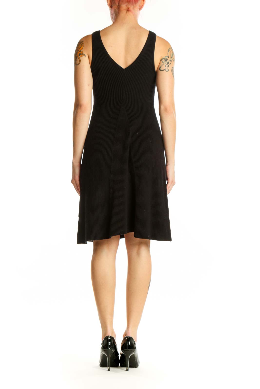 Black ribbed tank dress with A-line silhouette, back view showing sleeveless design