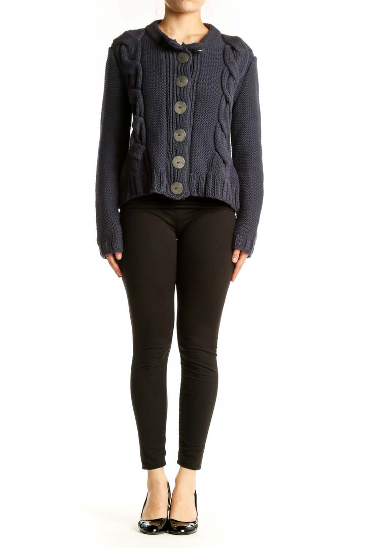 Navy cable knit cotton cardigan with button front closure and decorative cable patterns on sides