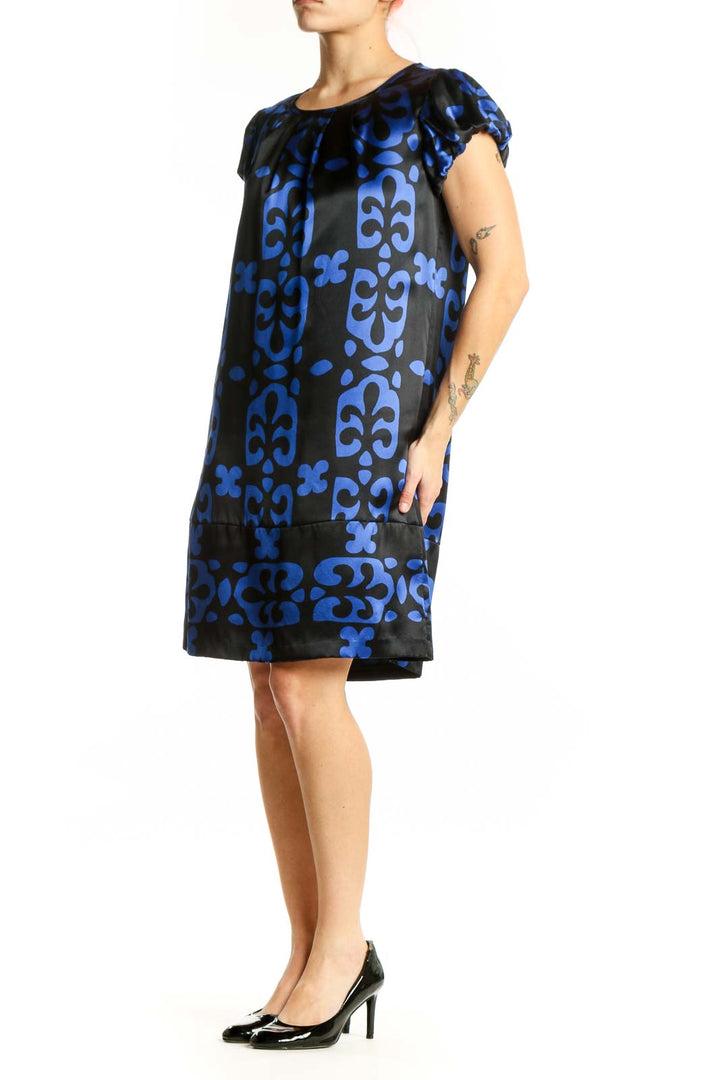 Black and blue floral print INC shift dress with cap sleeves, front view