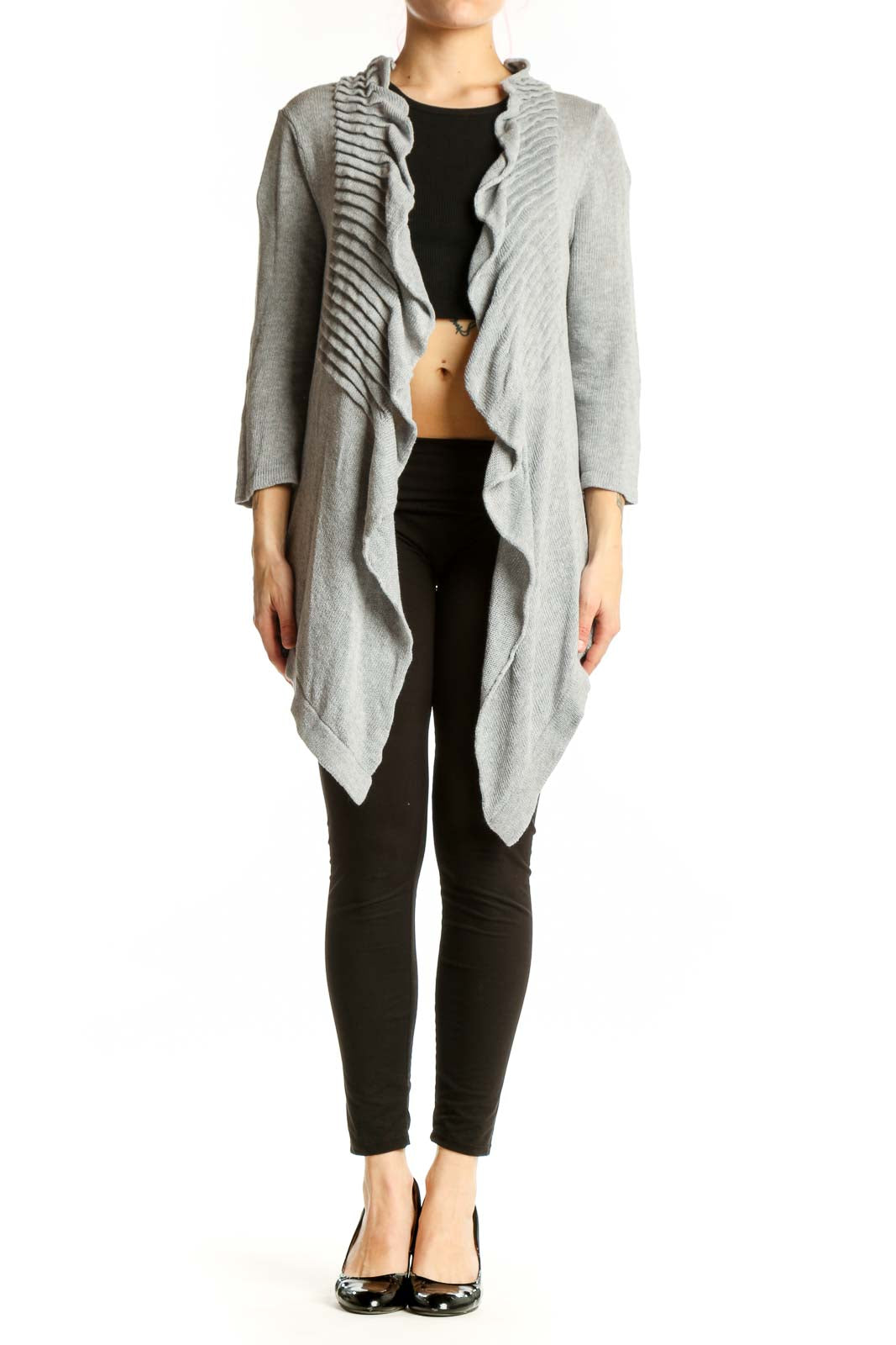Gray cotton cardigan with ruffled front detailing and open front design, worn over black top