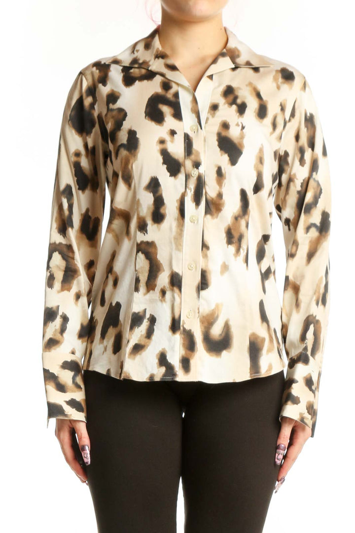 Front view of cream leopard print button-up shirt with black and tan animal pattern, long sleeves, and classic collar
