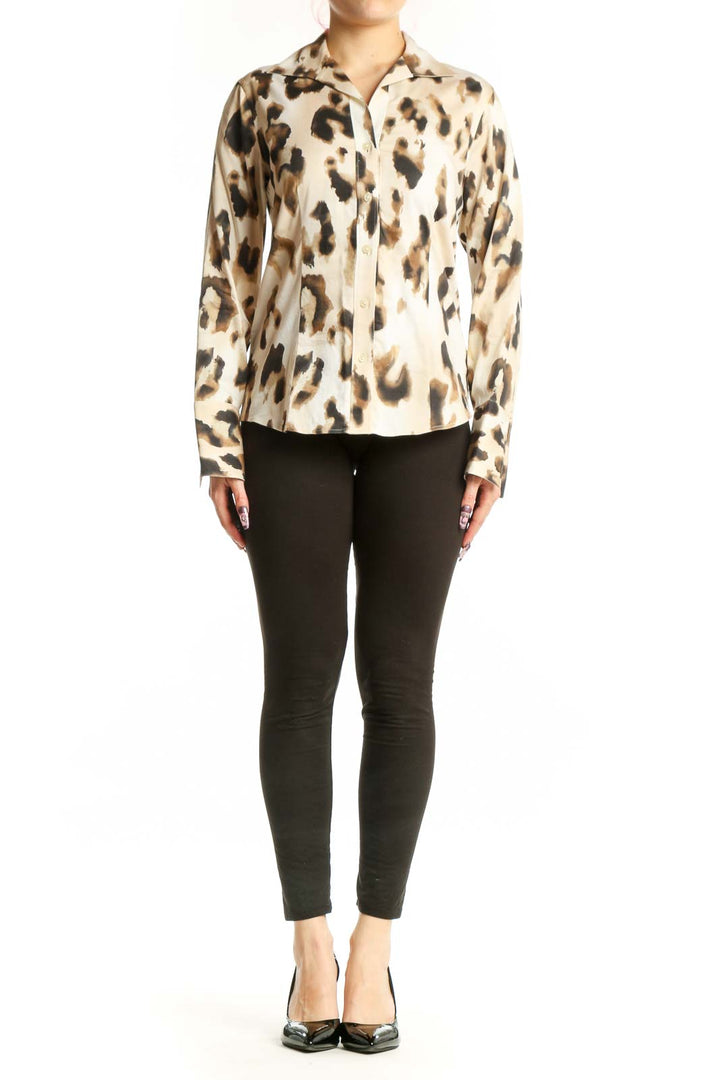 Front view of cream leopard print button-up shirt with black and tan animal pattern, long sleeves, and classic collar