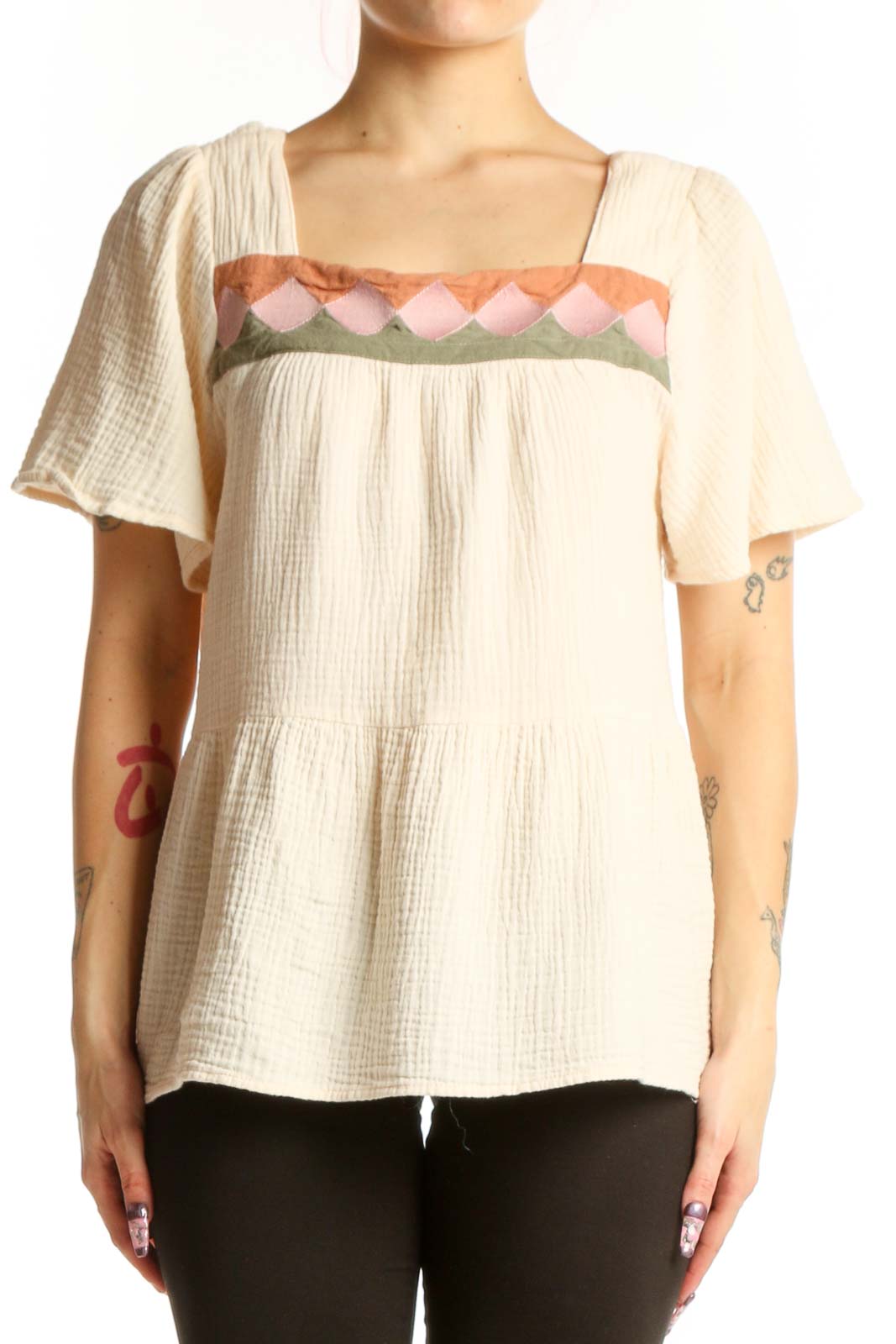Cream cotton short sleeve top with embroidered pink, coral and sage green scalloped neckline detail