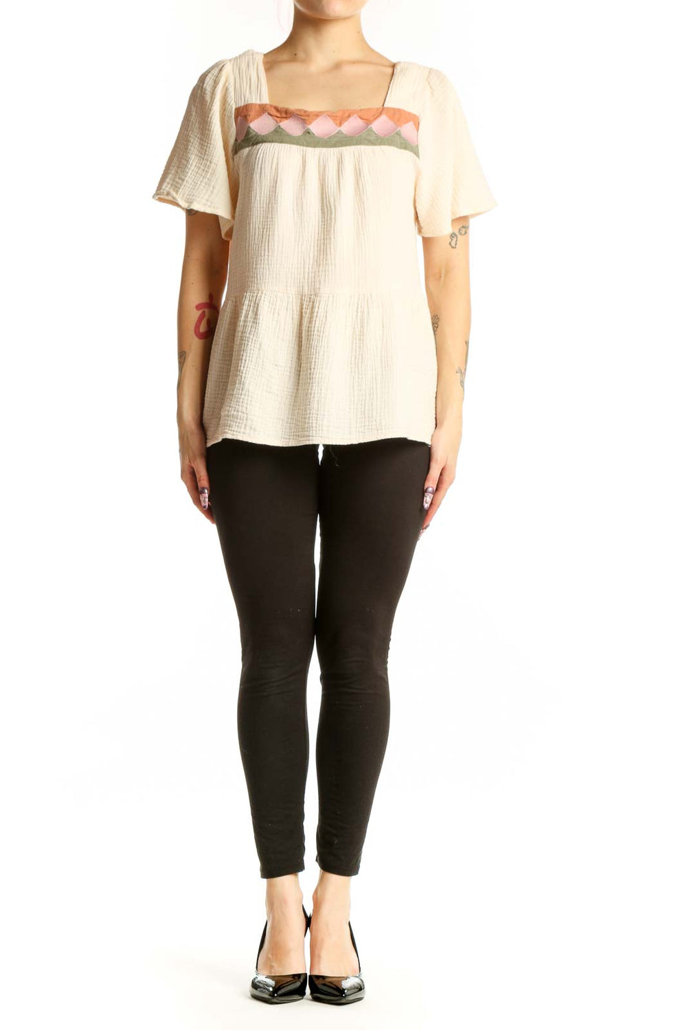 Cream cotton short sleeve top with embroidered pink, coral and sage green scalloped neckline detail