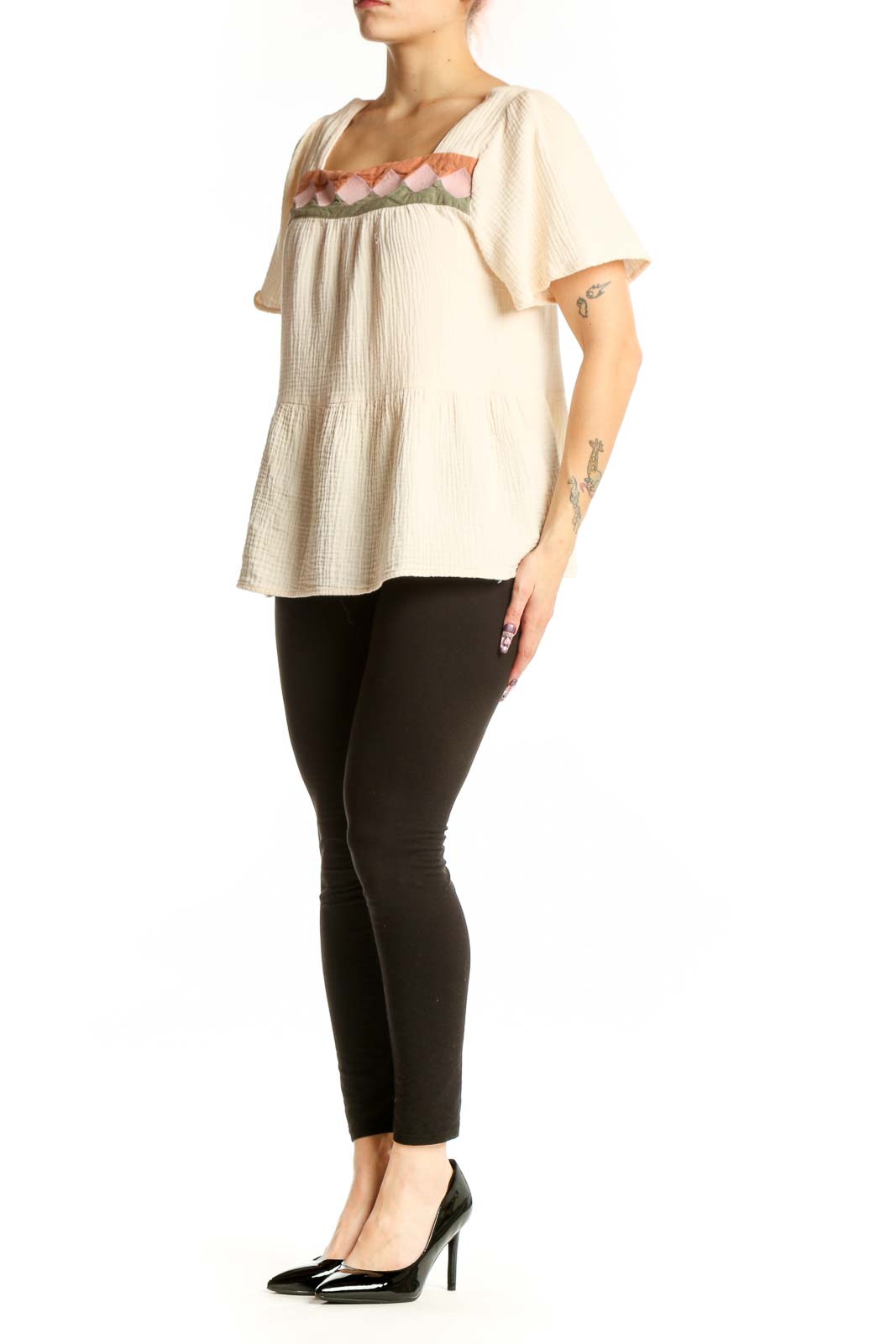 Cream cotton short sleeve top with embroidered pink, coral and sage green scalloped neckline detail