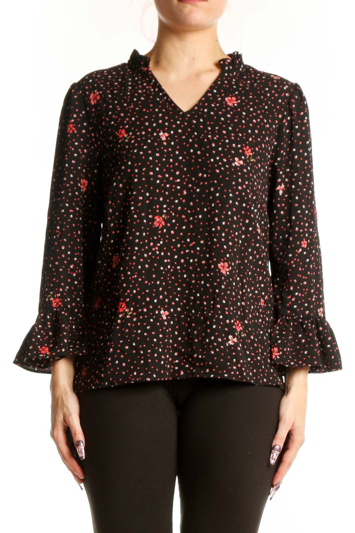 Black floral top with red and gold blooms and ruffle three-quarter sleeves, front view
