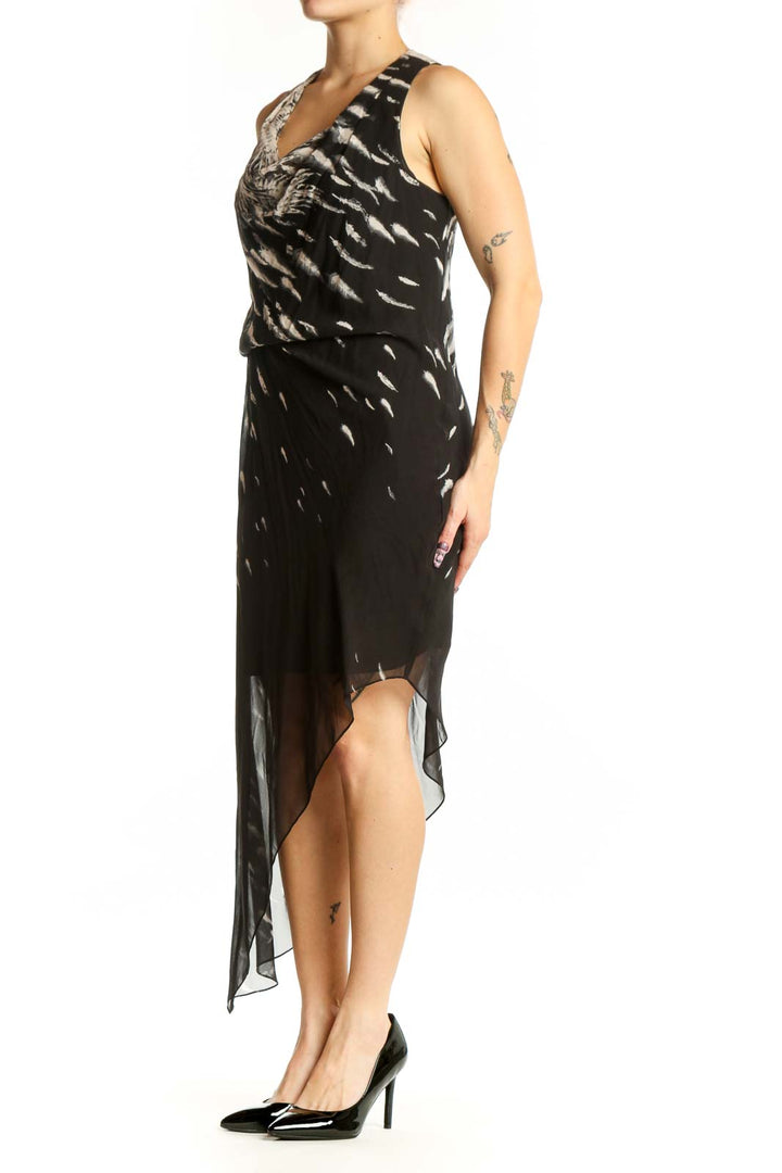 Black feather print wrap dress with asymmetrical hemline and sheer overlay, front view