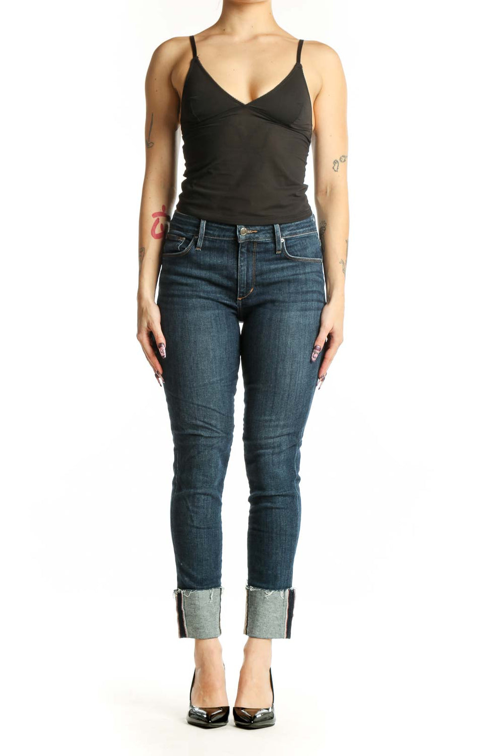 Front view of blue cropped skinny denim jeans with rolled cuffs and mid-rise fit