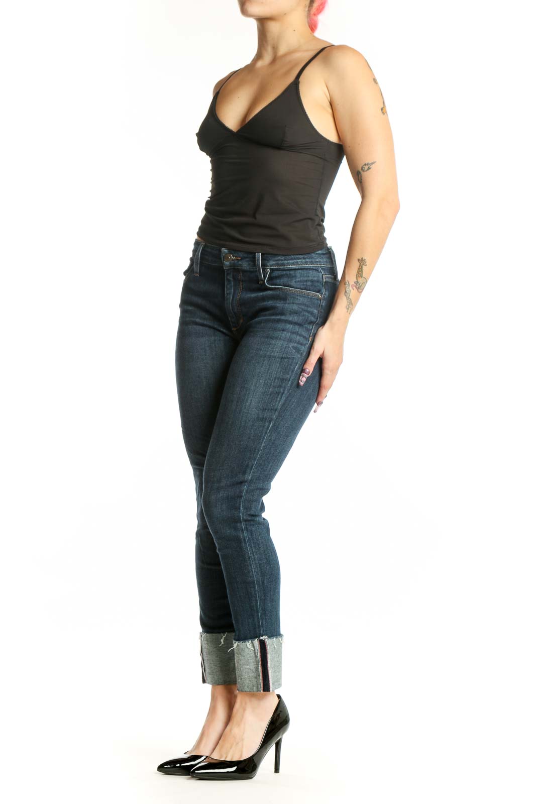 Front view of blue cropped skinny denim jeans with rolled cuffs and mid-rise fit