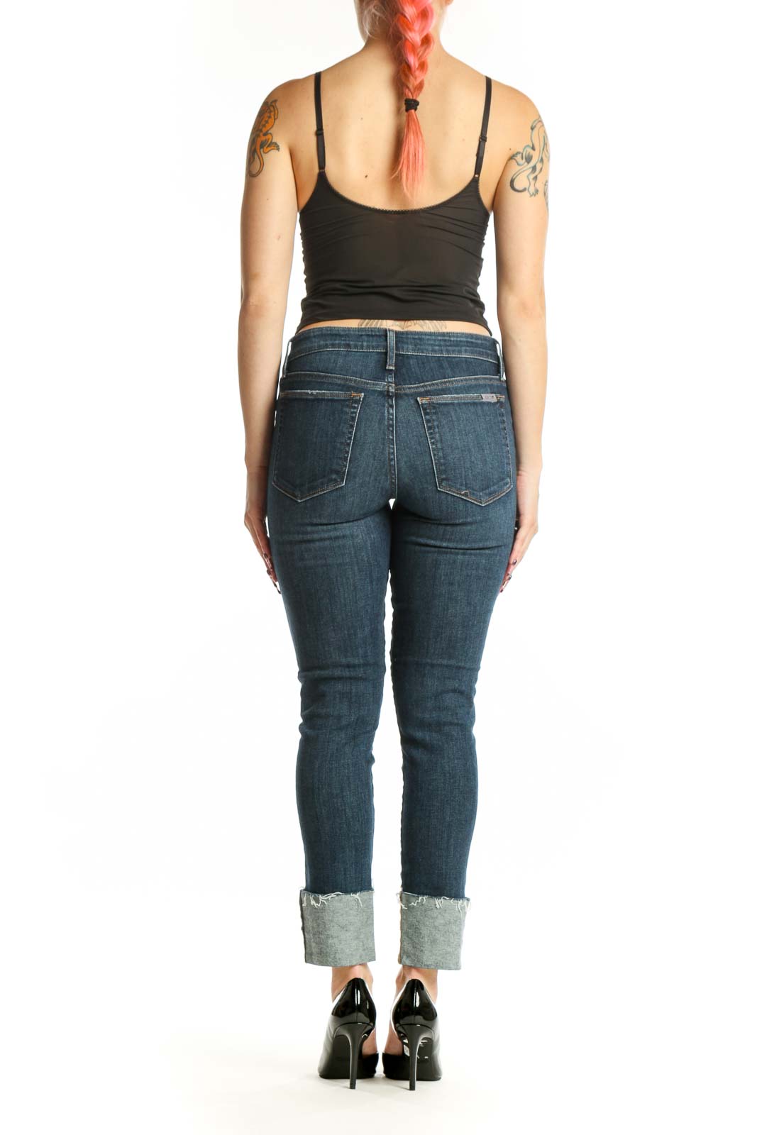 Back view of blue cropped skinny denim jeans showing classic five-pocket construction