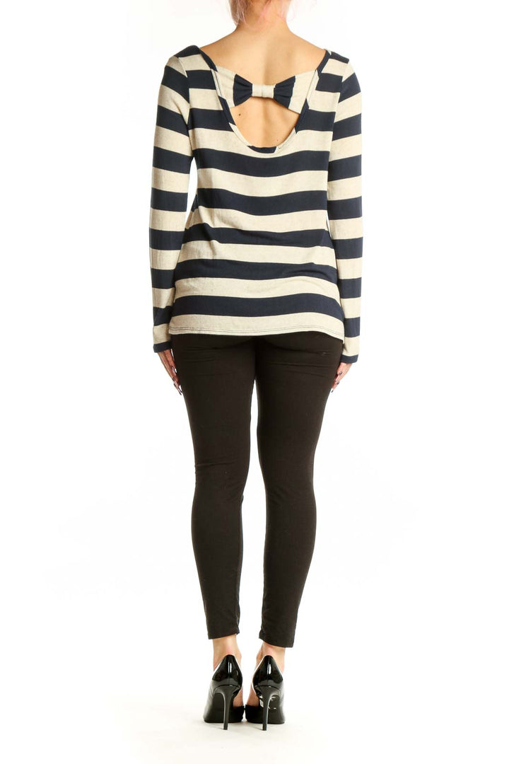 Navy and cream striped long sleeve top, back view showing relaxed fit