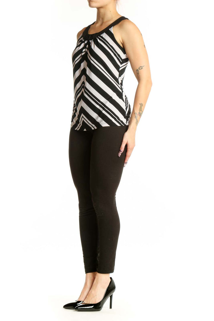 Black and white chevron striped sleeveless tank top with ruched crew neckline, front view