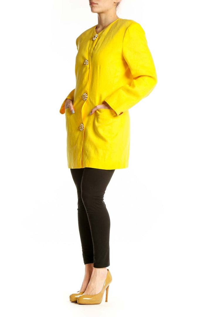 Front view of vibrant yellow Max Mara jacket with jeweled button-front closure and tailored silhouette