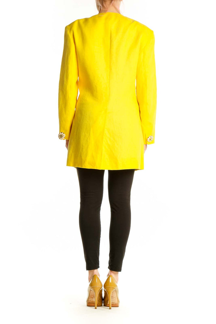 Back view of yellow cupro-linen Max Mara jacket showing tailored fit and structured design