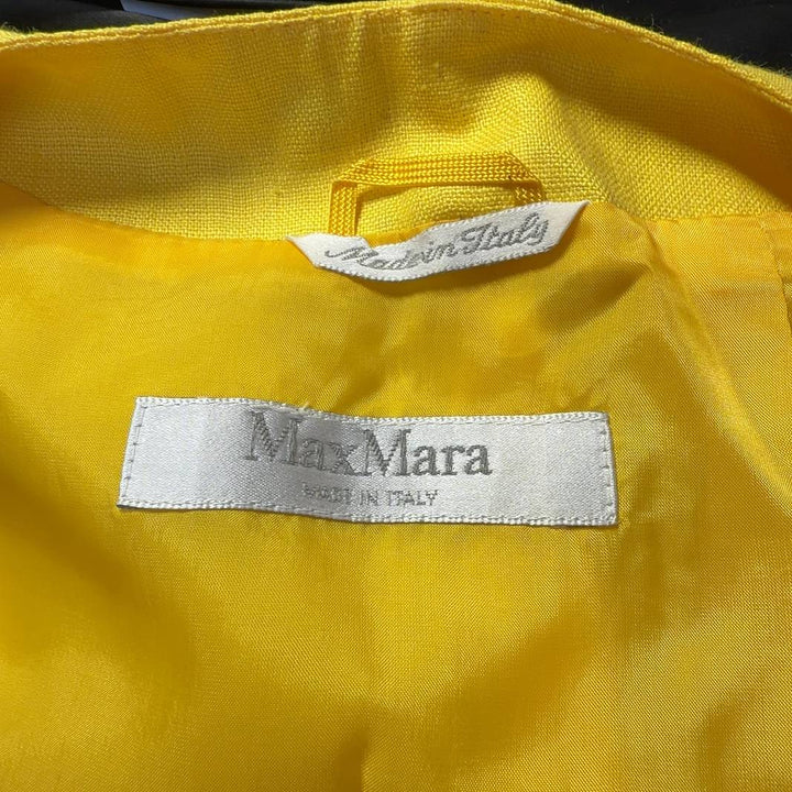Tag view of yellow cupro-linen Max Mara jacket showing tailored fit and structured design