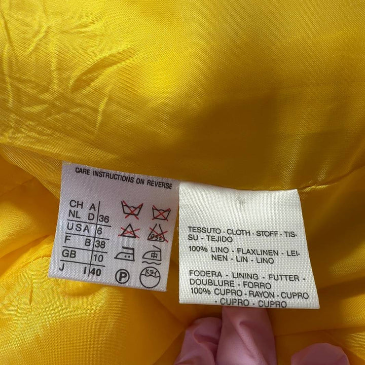 Tag view of yellow cupro-linen Max Mara jacket showing tailored fit and structured design