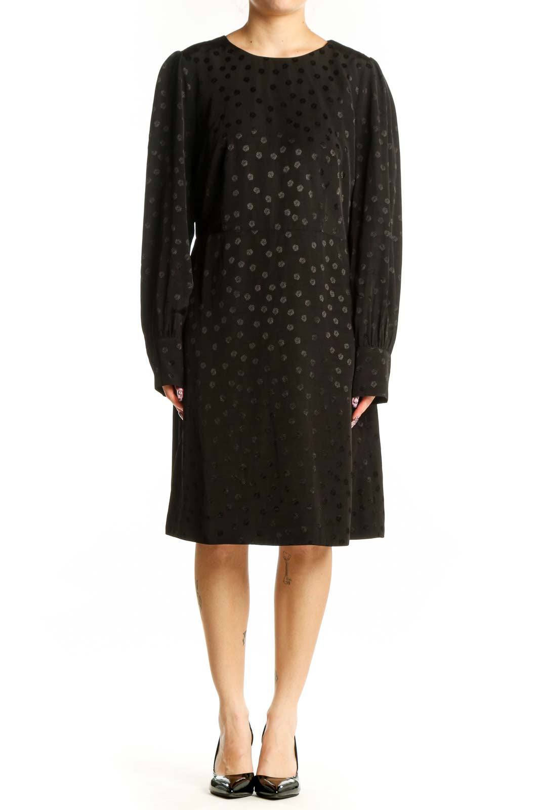 Black polka dot long sleeve dress with crew neckline and A-line silhouette, front view
