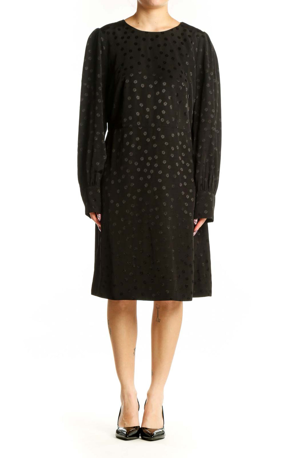 Black polka dot long sleeve dress with crew neckline and A-line silhouette, front view