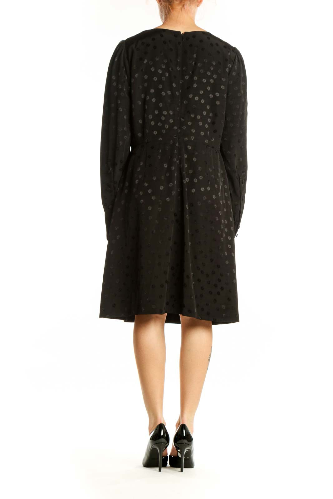 Black polka dot long sleeve dress with gathered cuffs, back view