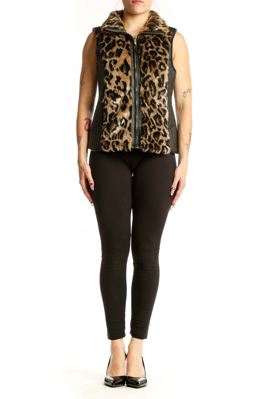 Black and tan leopard print faux fur vest with full-zip front and collared neckline, worn with black leggings