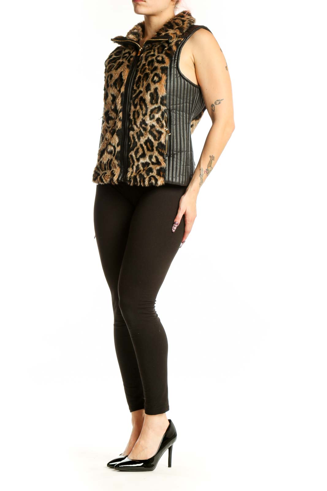 Black and tan leopard print faux fur vest with full-zip front and collared neckline, worn with black leggings