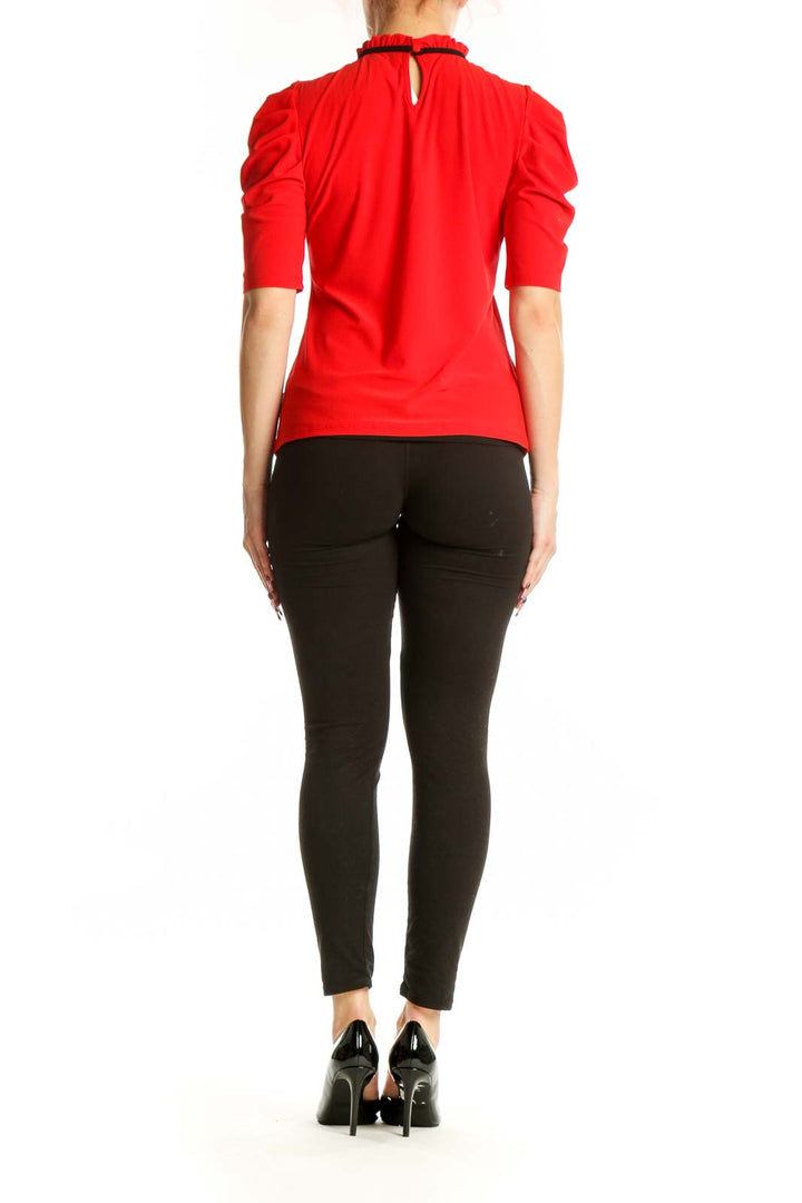 Red puff sleeve top with ruched neckline, back view