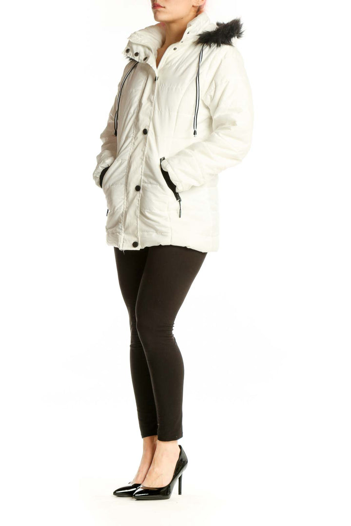White quilted puffer coat with black faux fur-trimmed hood and functional zippered pockets