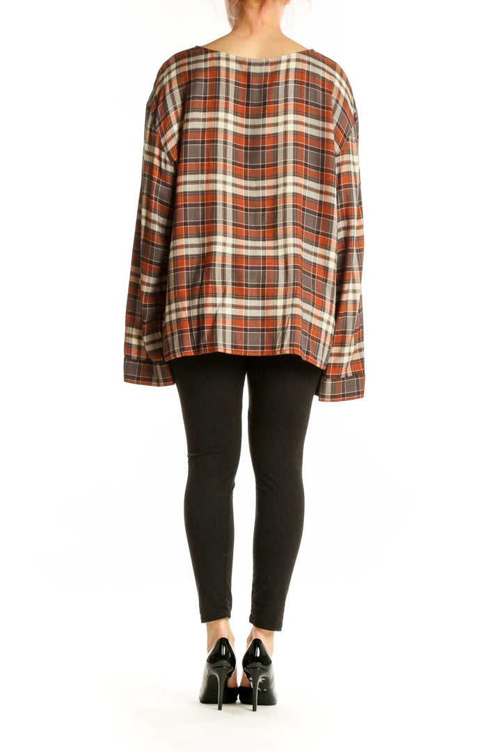Orange and cream plaid V-neck long sleeve top with oversized fit, back view