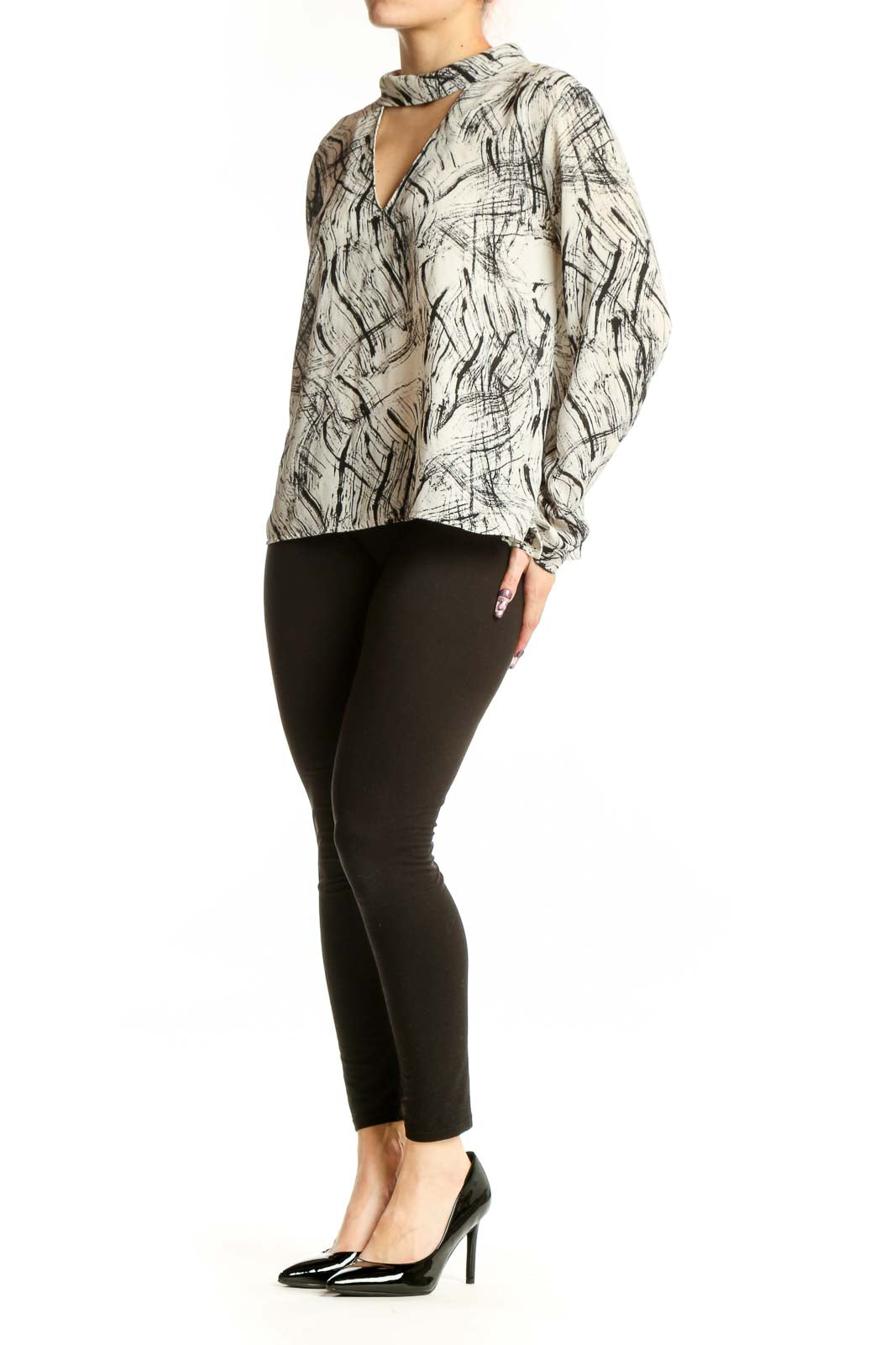 Cream and black abstract print choker blouse with cutout neckline and gathered cuffs, front view