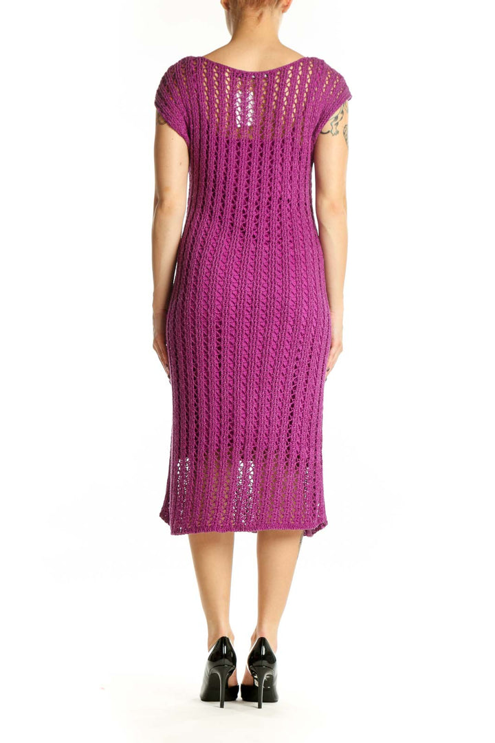 Back view of purple ribbed knit midi dress showing vertical ribbed pattern and elegant drape
