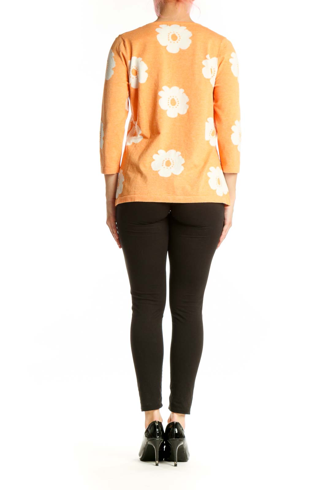 Orange floral print top back view showing daisy pattern distribution, three-quarter sleeves, relaxed fit silhouette