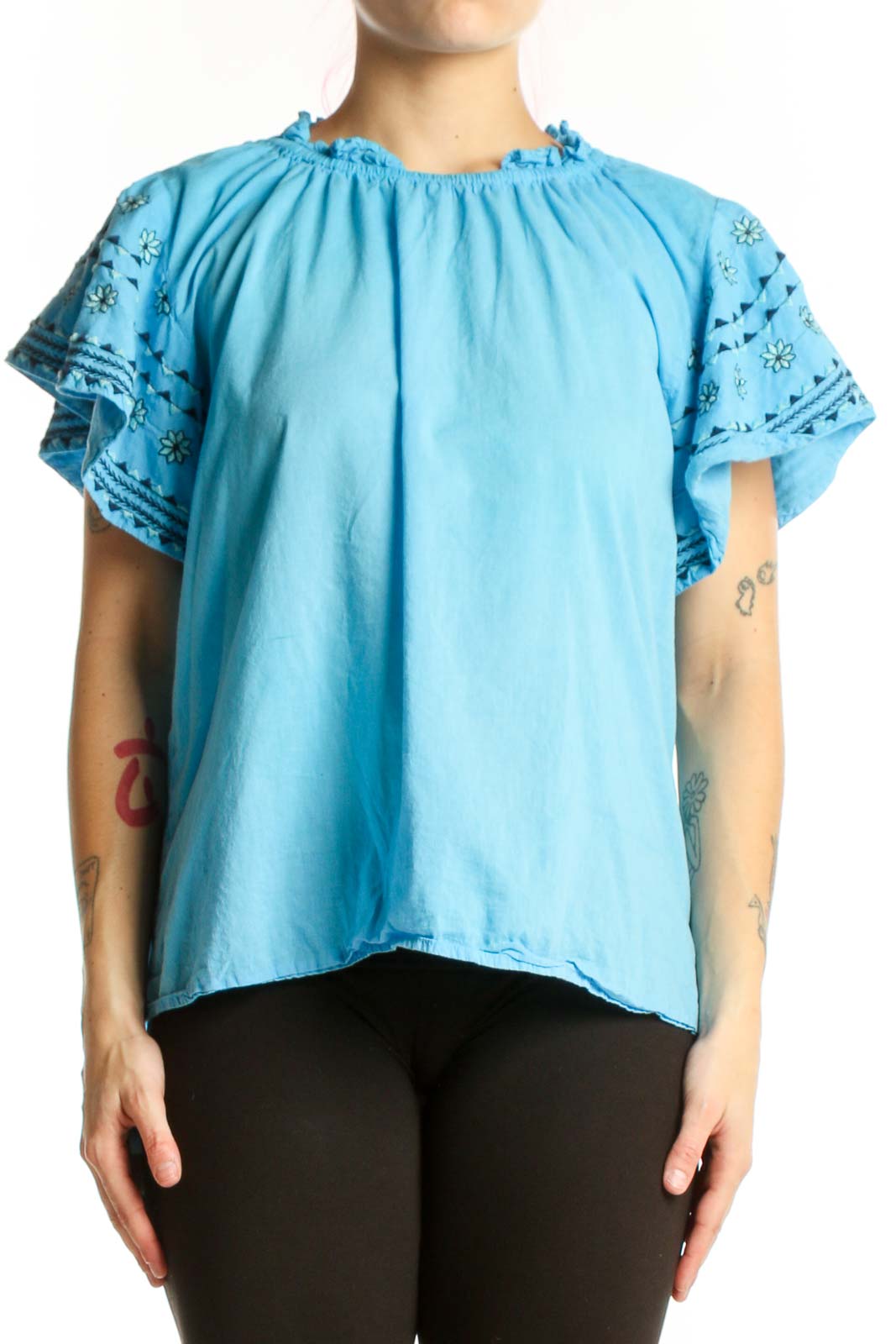 Blue cotton top with ruffled lace sleeves and gathered neckline, front view