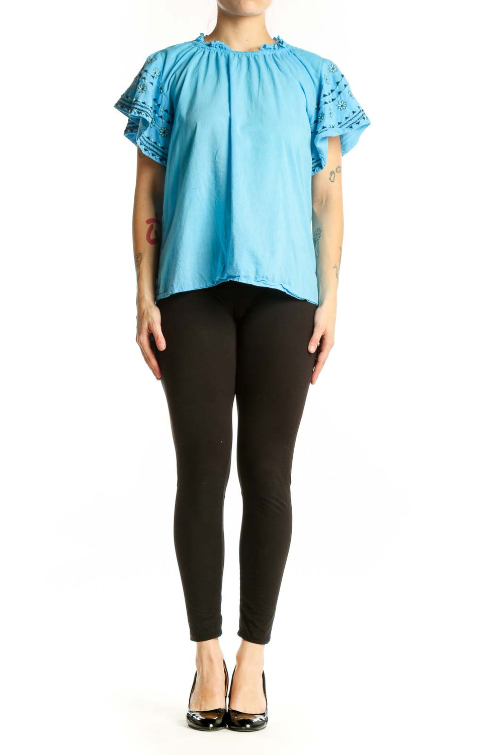 Blue cotton top with ruffled lace sleeves and gathered neckline, front view