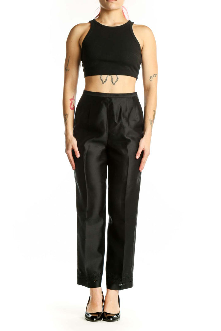 Front view of black silk polyester dress pants with high-waisted silhouette and straight-leg cut