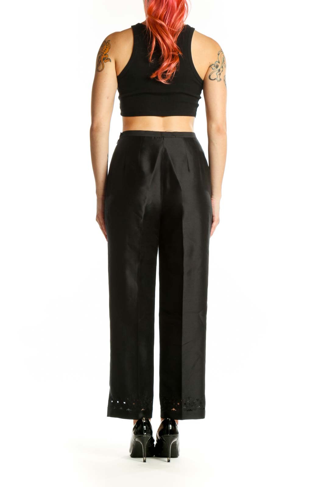 Back view of black dress pants showing tailored fit and refined drape