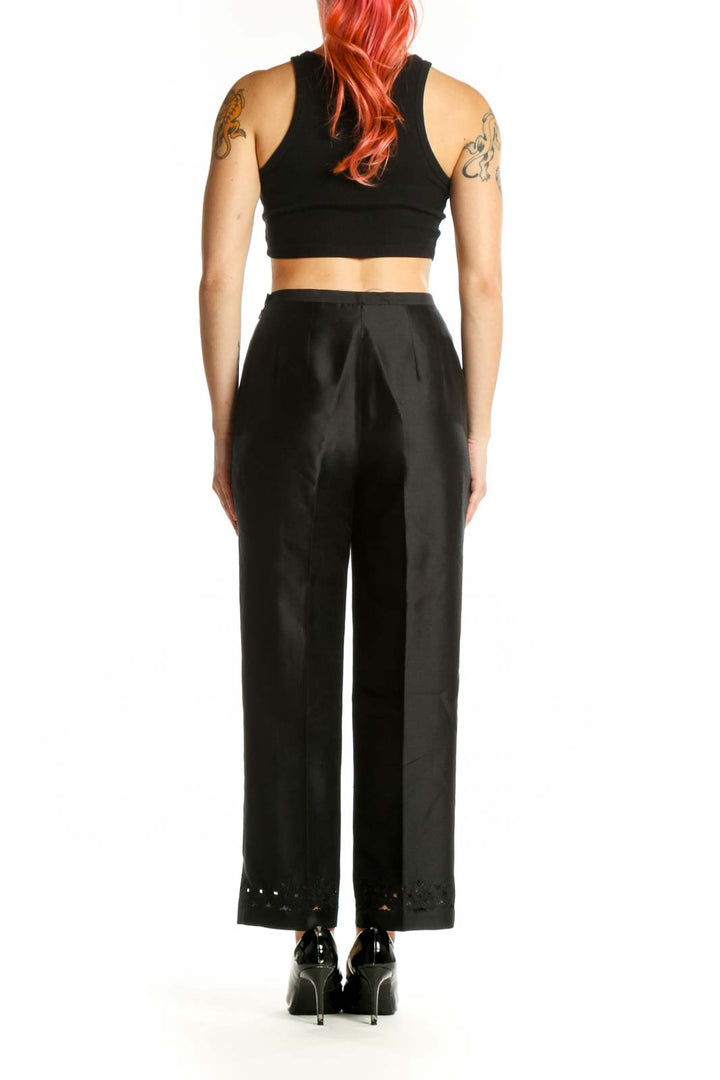 Back view of black dress pants showing tailored fit and refined drape