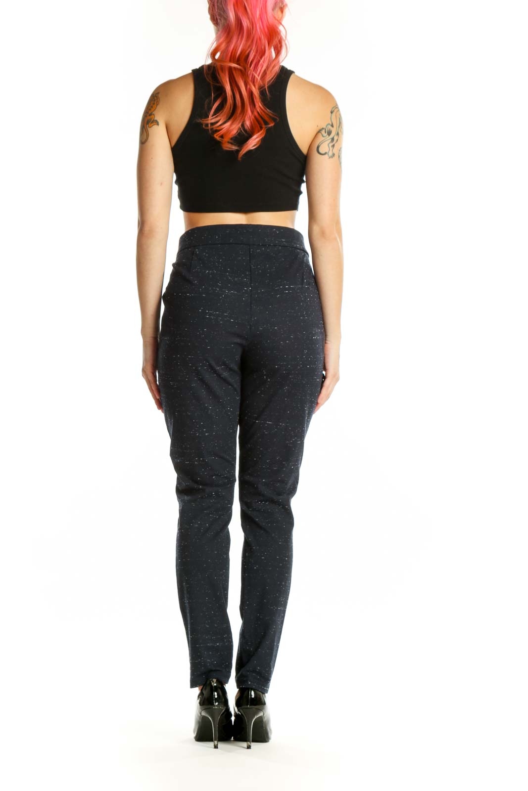 Black speckled ankle pants with tapered fit, back view on model
