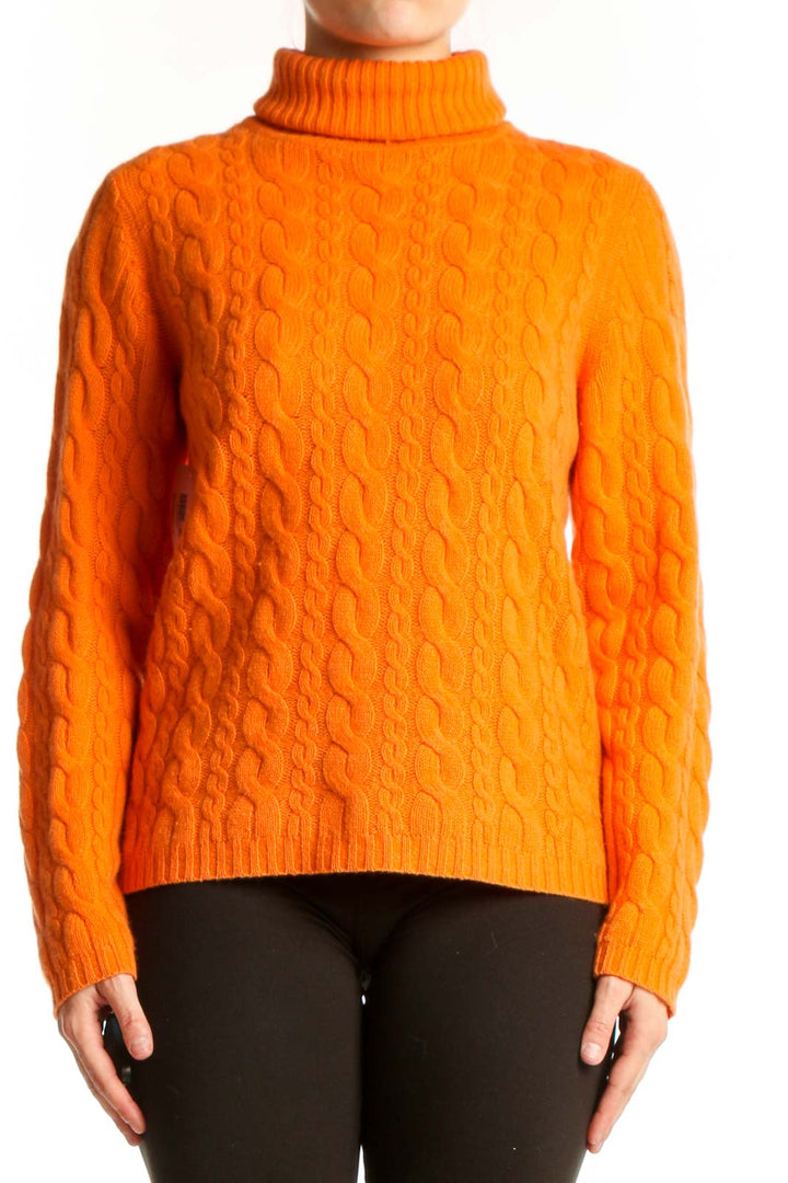 Orange cashmere cable knit turtleneck by DonCaster, front view showing intricate textured pattern and classic turtleneck collar